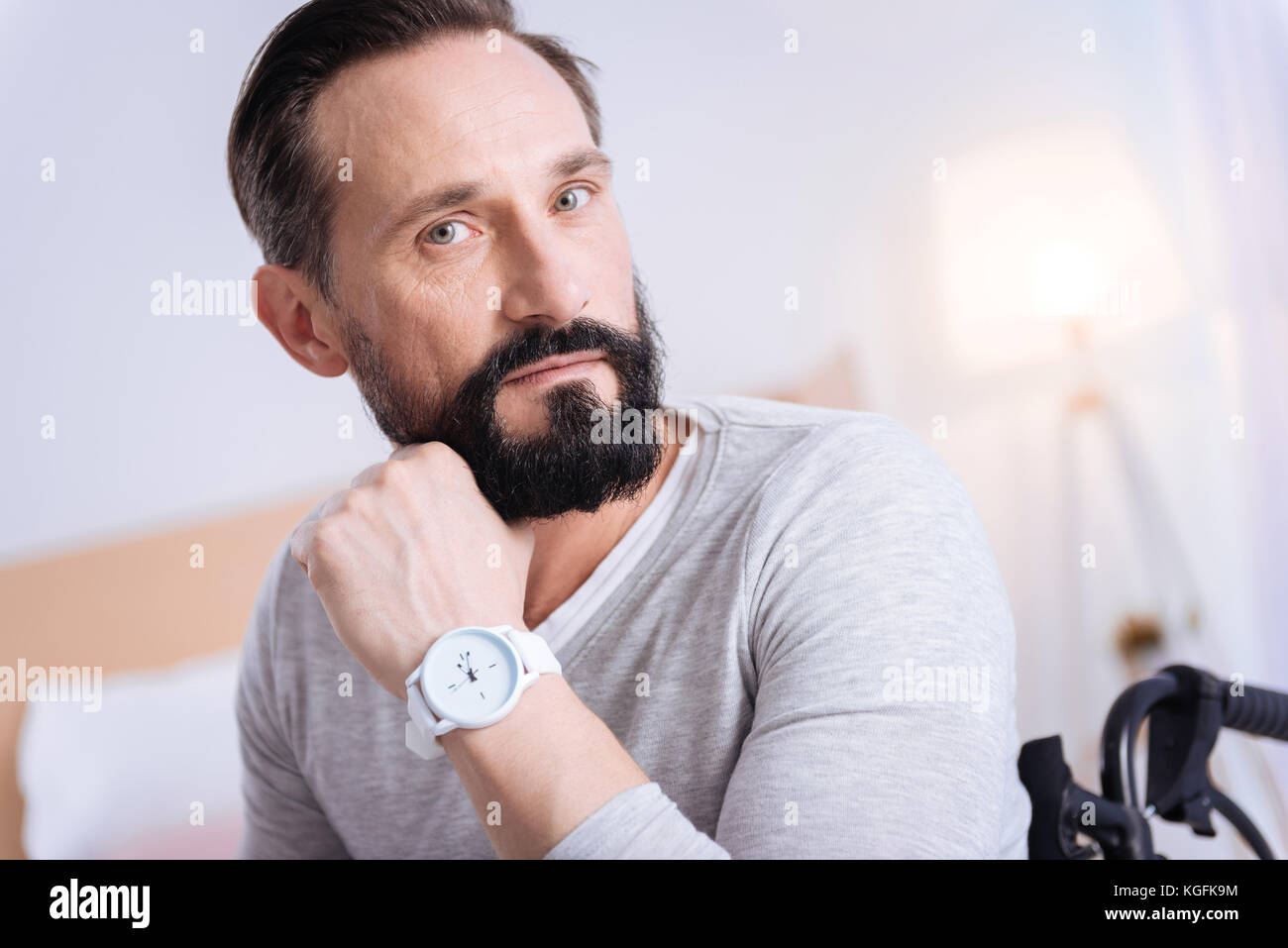 Handsome serious paralyzed man thinking Stock Photo