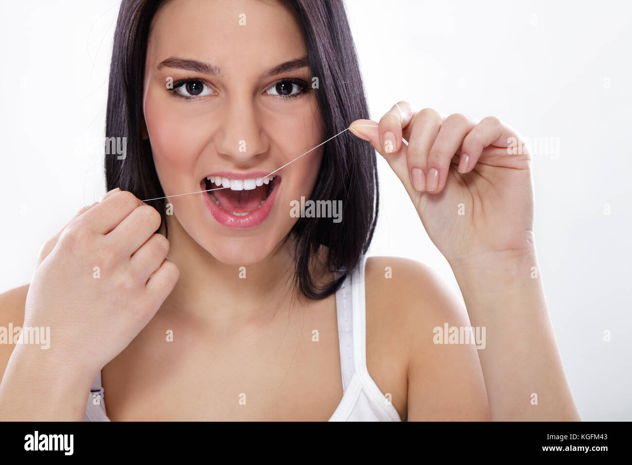 Young attractive woman with dental floss Stock Photo Alamy