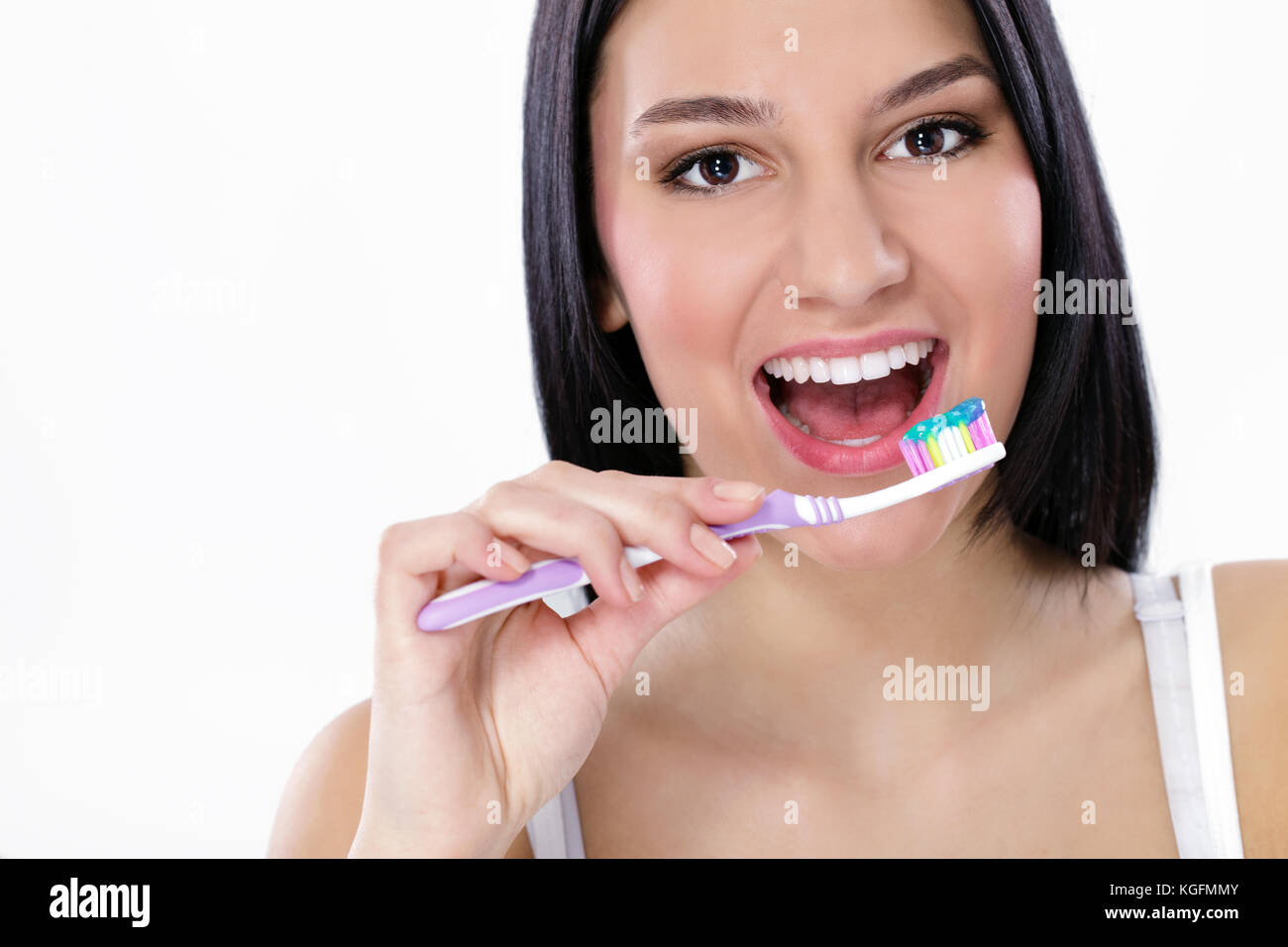 young woman with healthy teeth holding a toothbrush Stock Photo Alamy