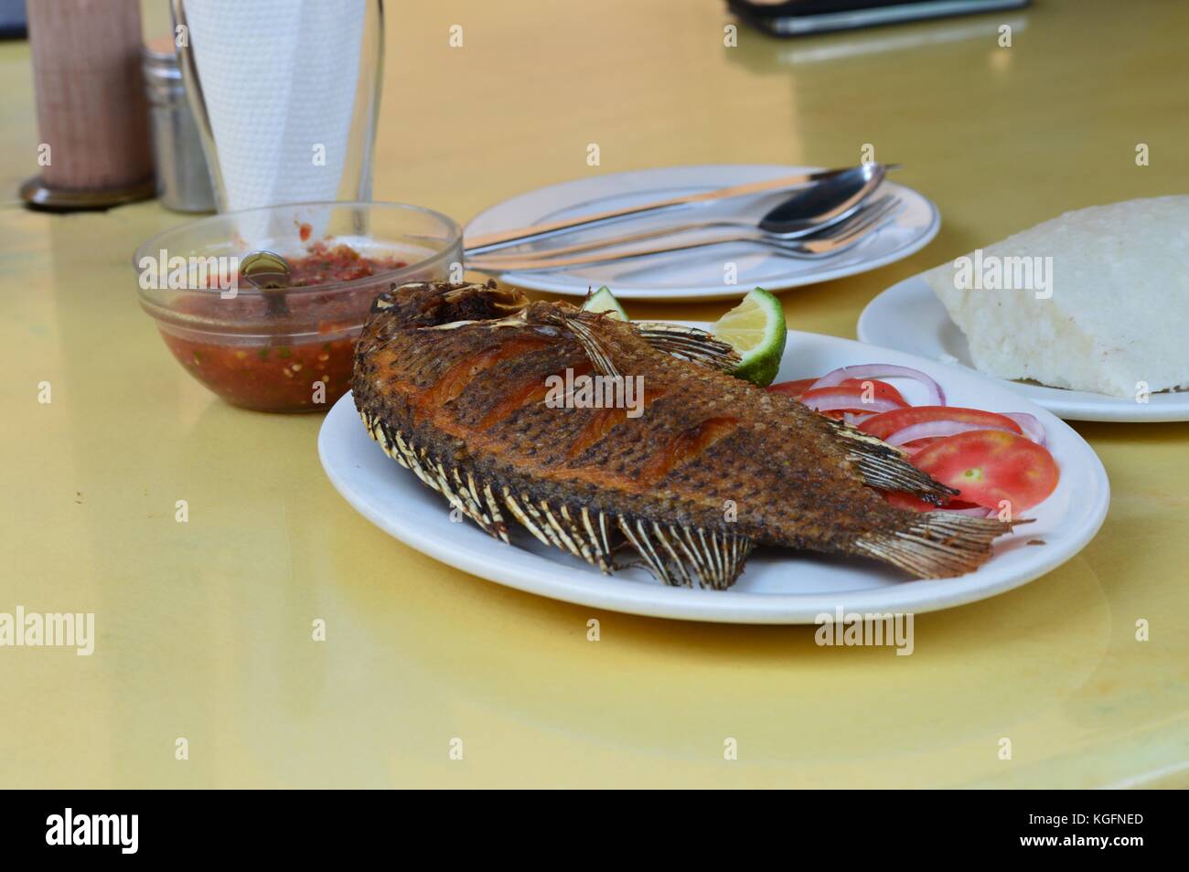 Fried Tilapia with the sauce on the side Stock Photo Alamy
