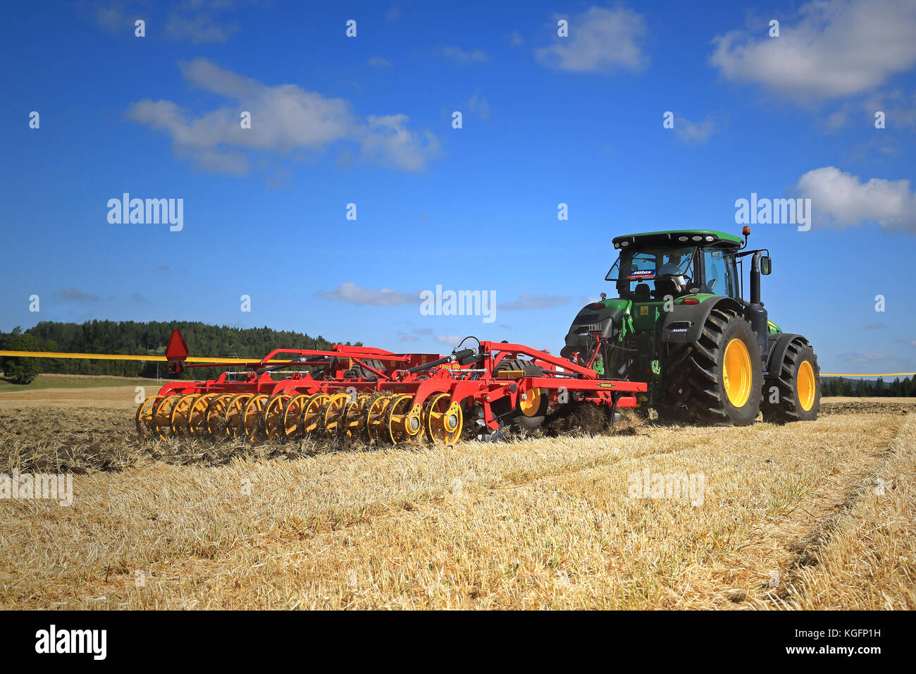SALO, FINLAND - AUGUST 22, 2015: John Deere 8370R tractor and Vaderstad Opus 400 cultivator on field at Puontin Peltopaivat Agricultural Harvesting an Stock Photo