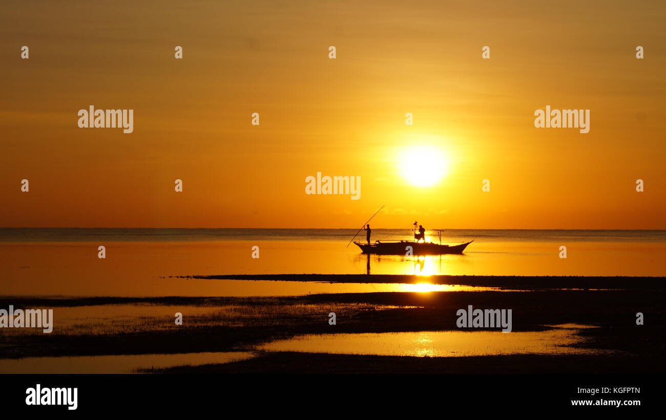 sunset on the beach Stock Photo - Alamy
