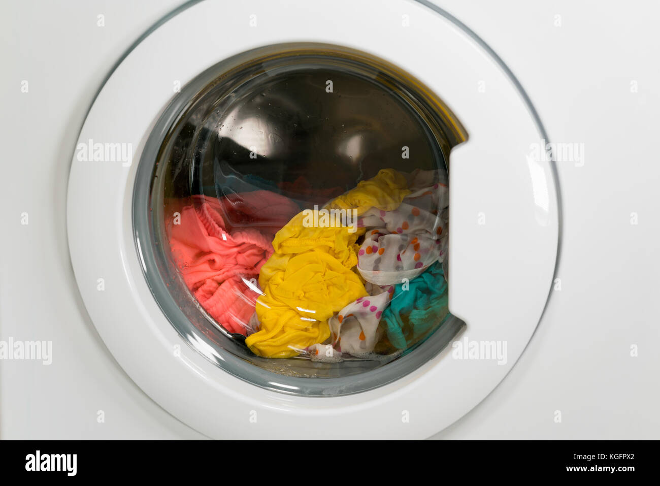 Washing machine is washing clothes Stock Photo Alamy