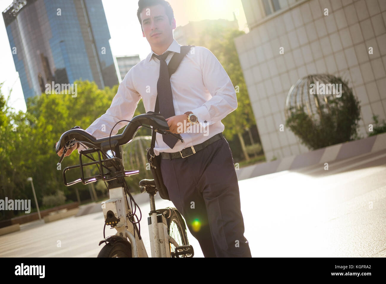 Young businessman riding a bike to work in the city Stock Photo Alamy