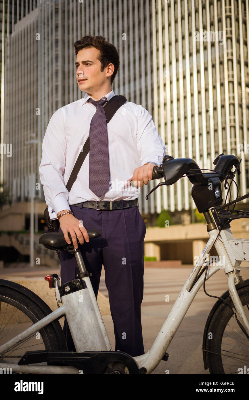 Young businessman riding a bike to work in the city Stock Photo Alamy