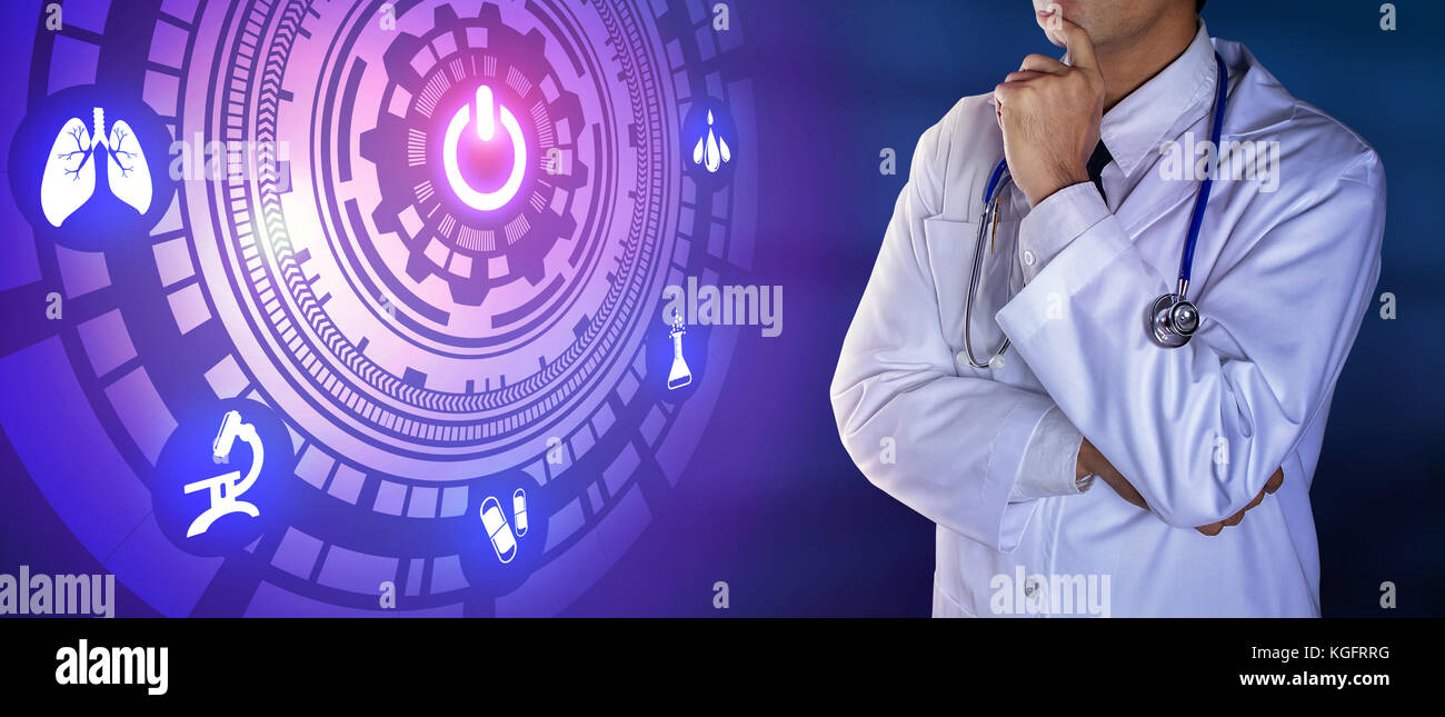 Doctor with stethoscope touching the digital icons Stock Photo