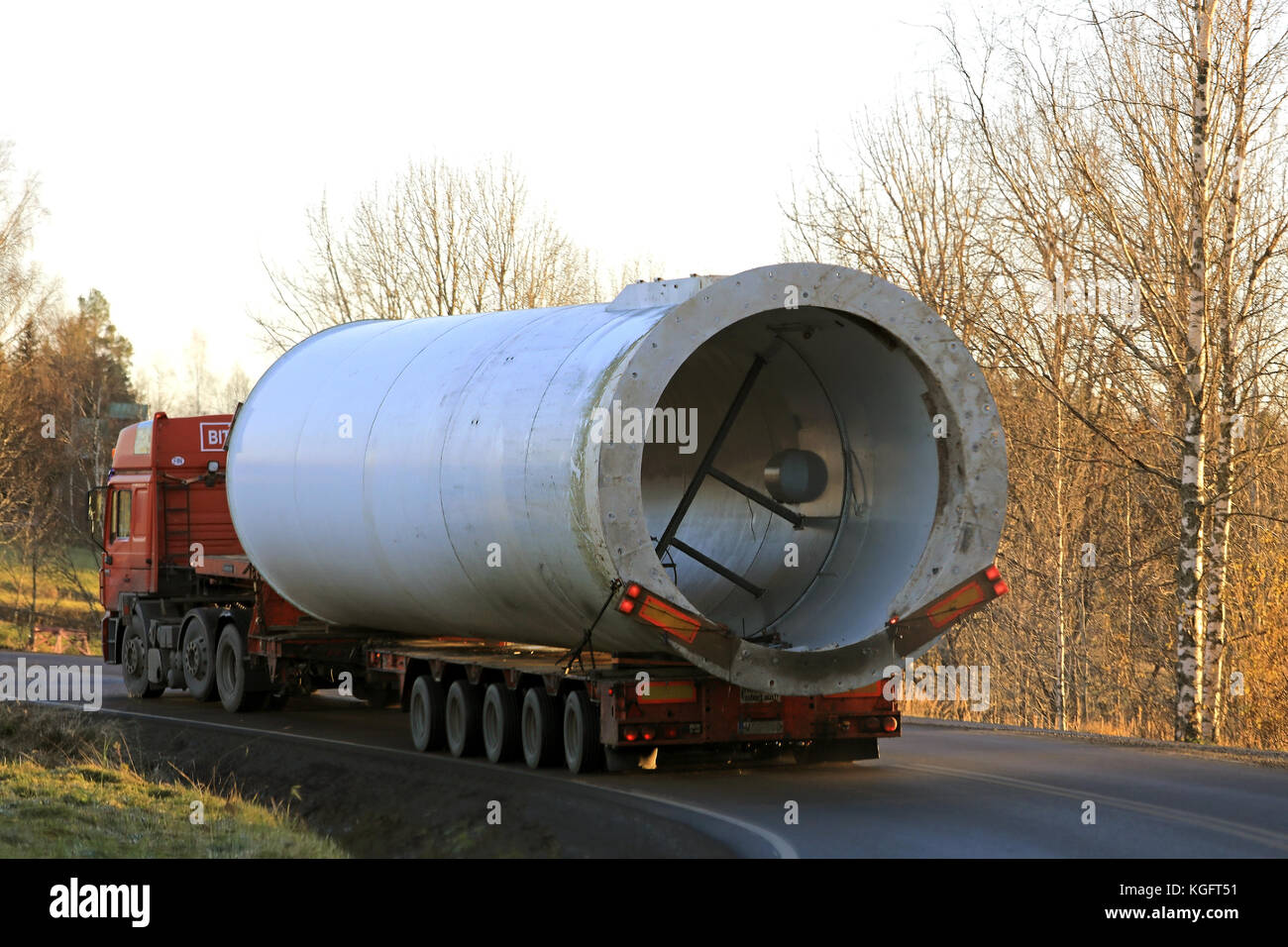 SOMERO, FINLAND - NOVEMBER 3, 2017: Oversize load semi trailer transport keeps left on the turn of a country lane during the transport of a wind turbi Stock Photo