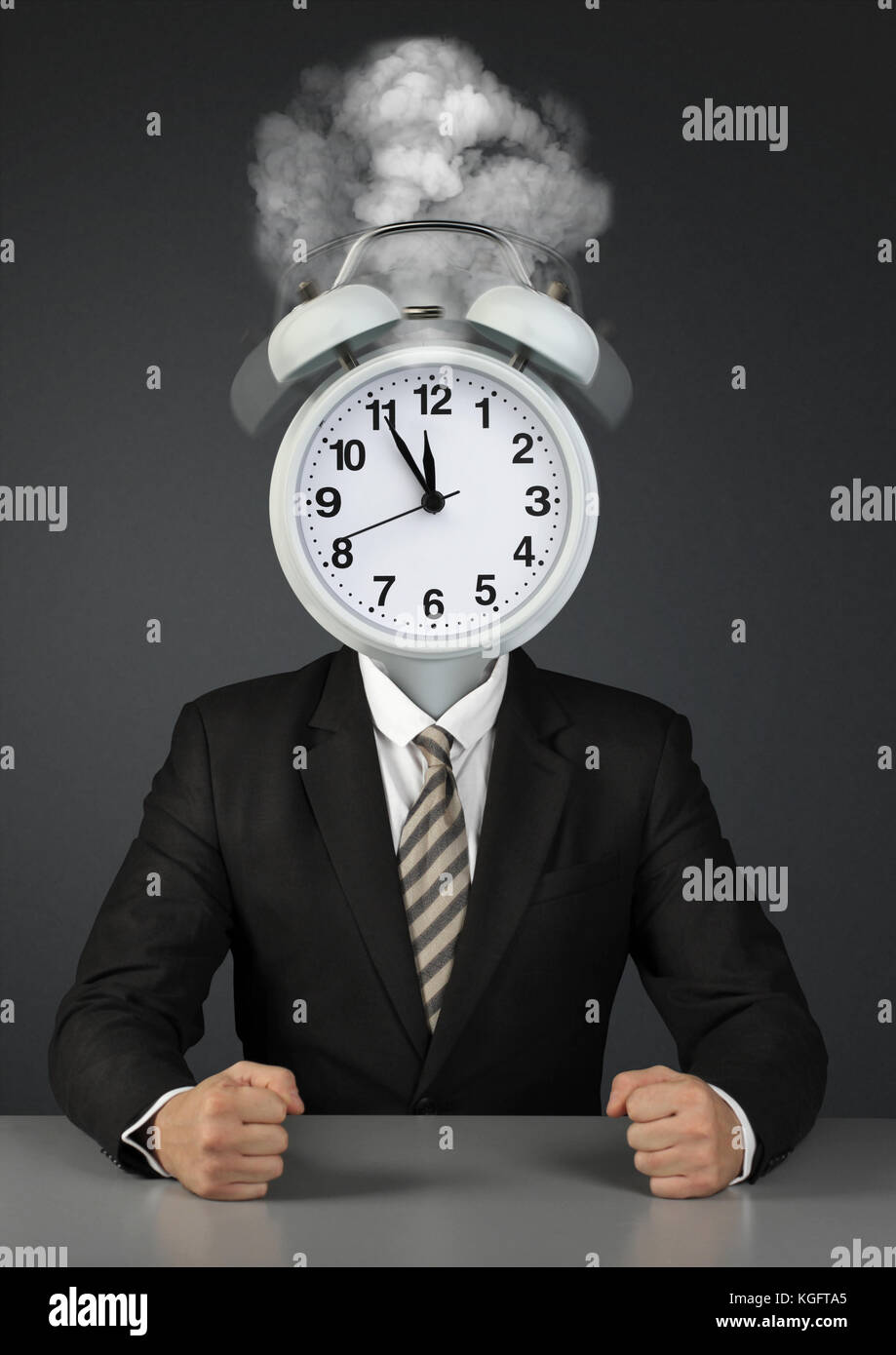 Businessman with alarm clock instead of head, lack of time concept Stock Photo