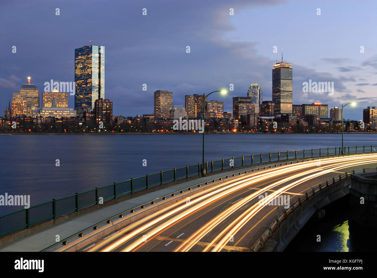 Boston skyline at night. Panoramic view of Back Bay and Charles River, blurred traffic lights on Memorial Drive, Cambridge Stock Photo