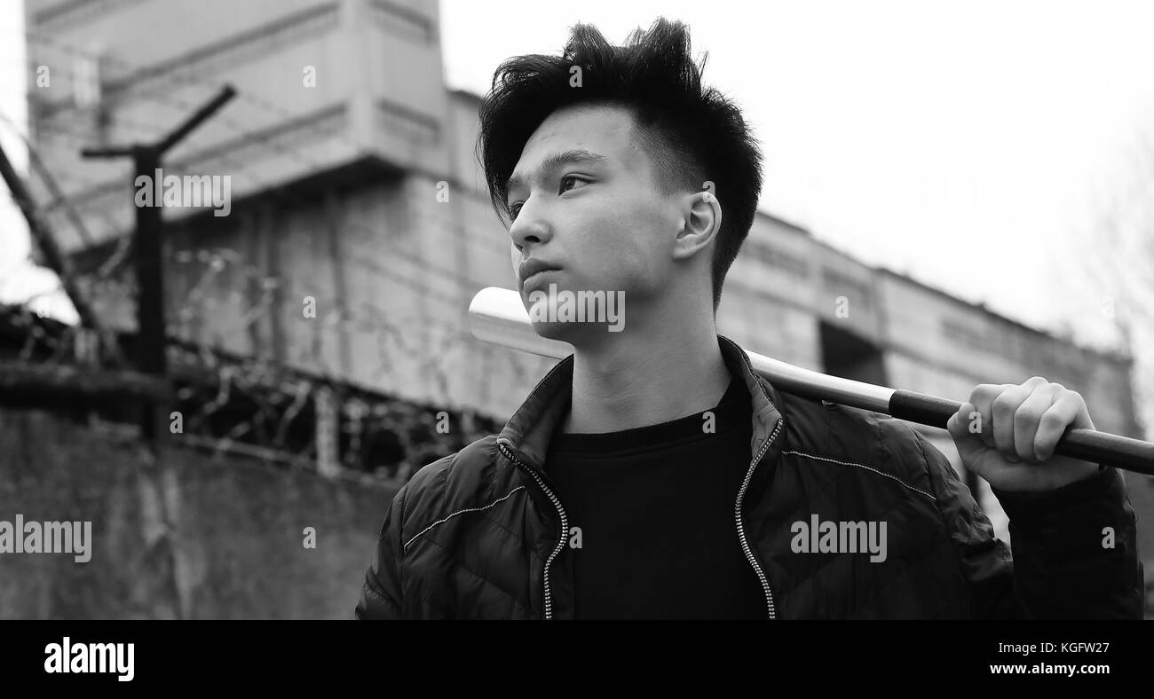 Black White photo of Asian young man outdoors posing Stock Photo - Alamy