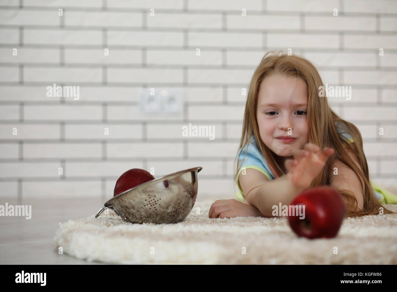 little girl lies on the floor Stock Photo - Alamy