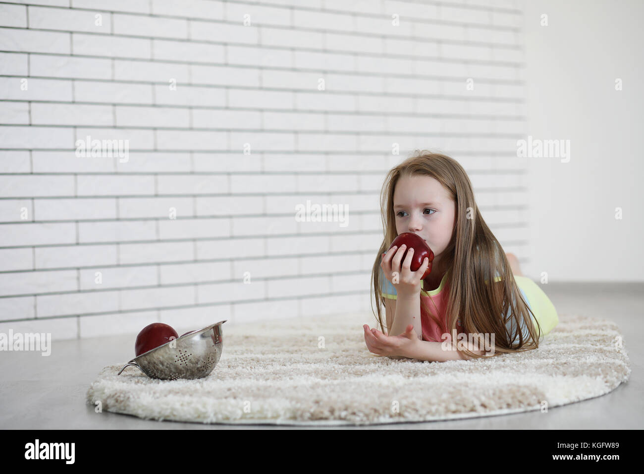 little girl lies on the floor Stock Photo - Alamy