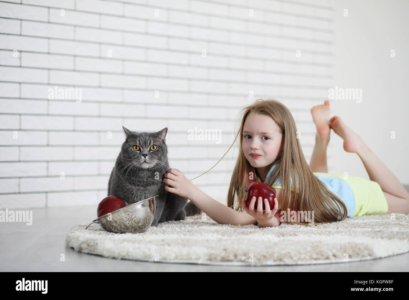 little girl lies on the floor Stock Photo - Alamy