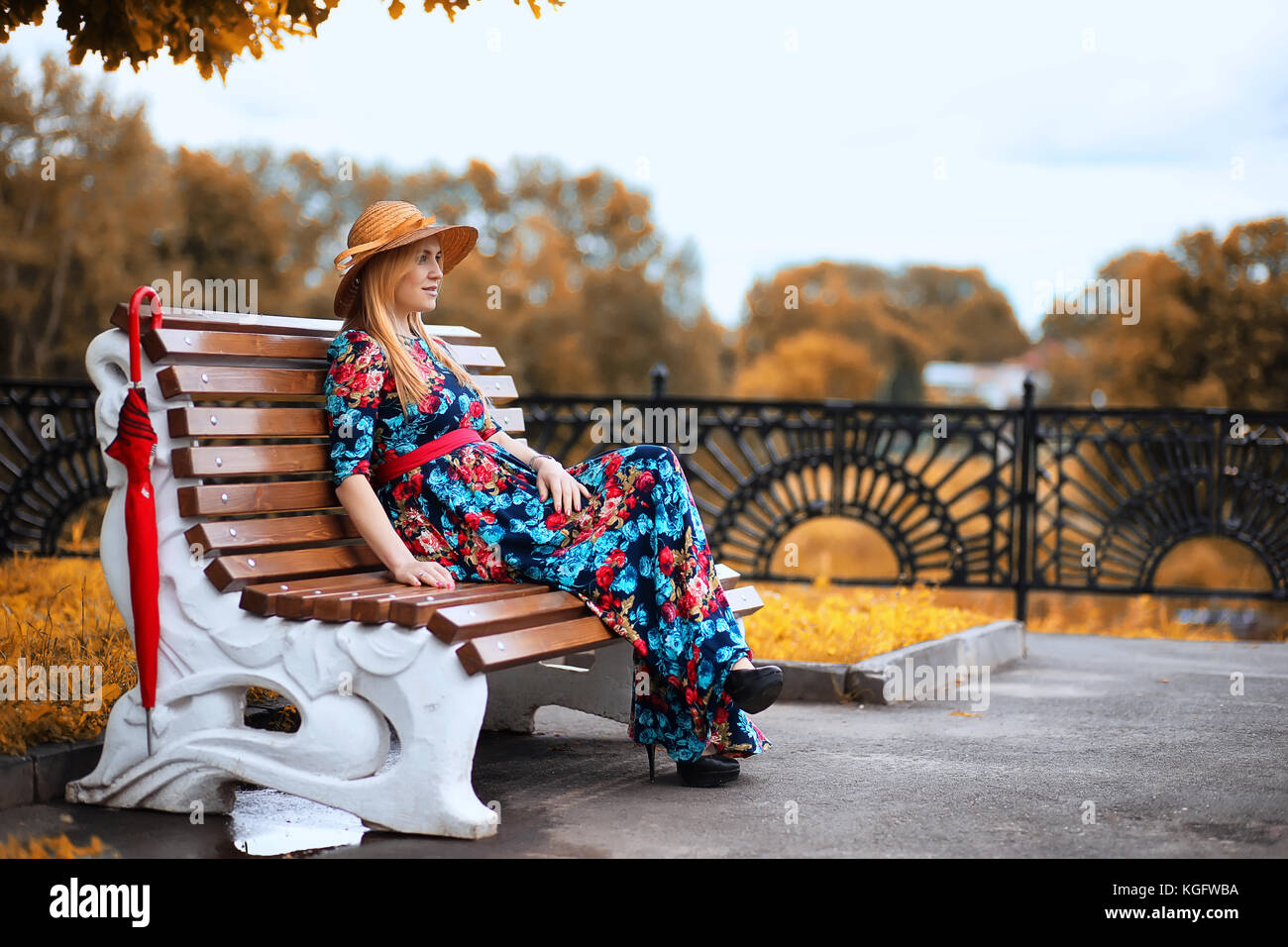 Girl in the street with an umbrella Stock Photo - Alamy
