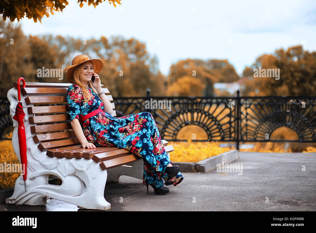 Girl in the street with an umbrella Stock Photo - Alamy