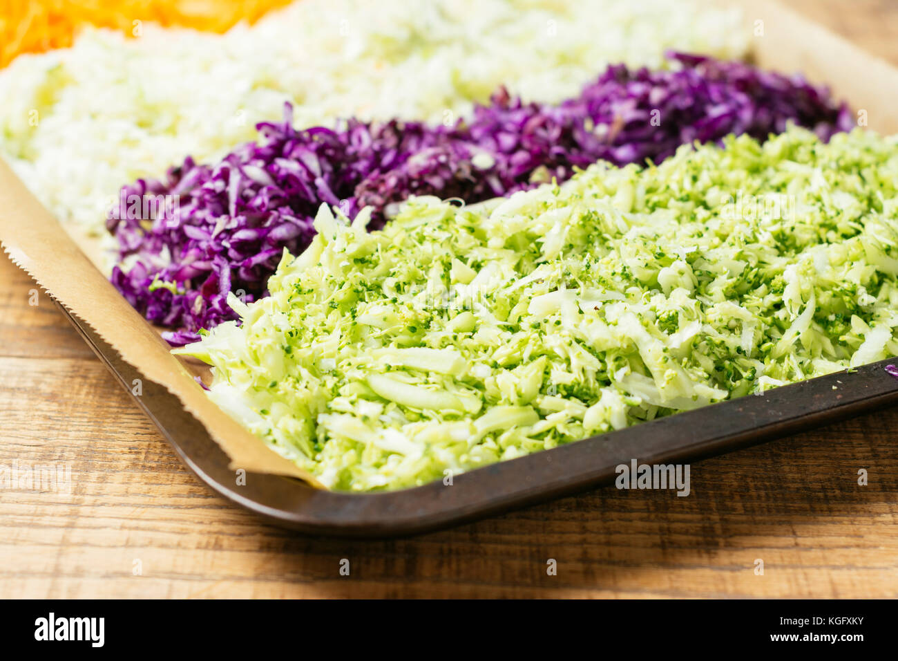 Shredded green and purple cabbage, broccoli, carrots Stock Photo Alamy