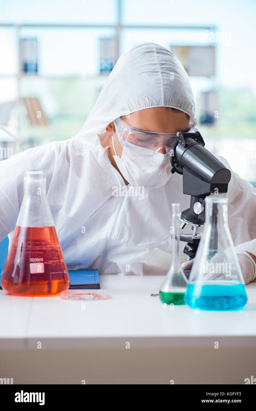 Chemist working in the laboratory with hazardous chemicals Stock Photo