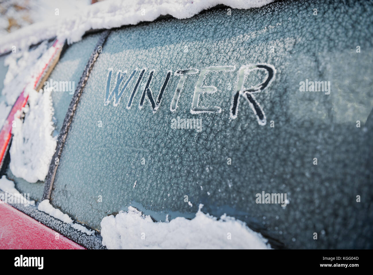 Frozen car window, car parked outside, winter transport issues Stock