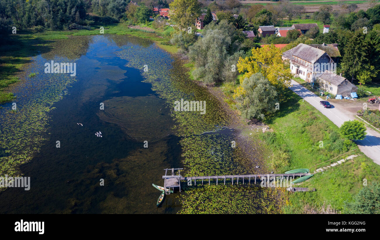 Aerial view of the traditional wooden village near the oxbow lake in