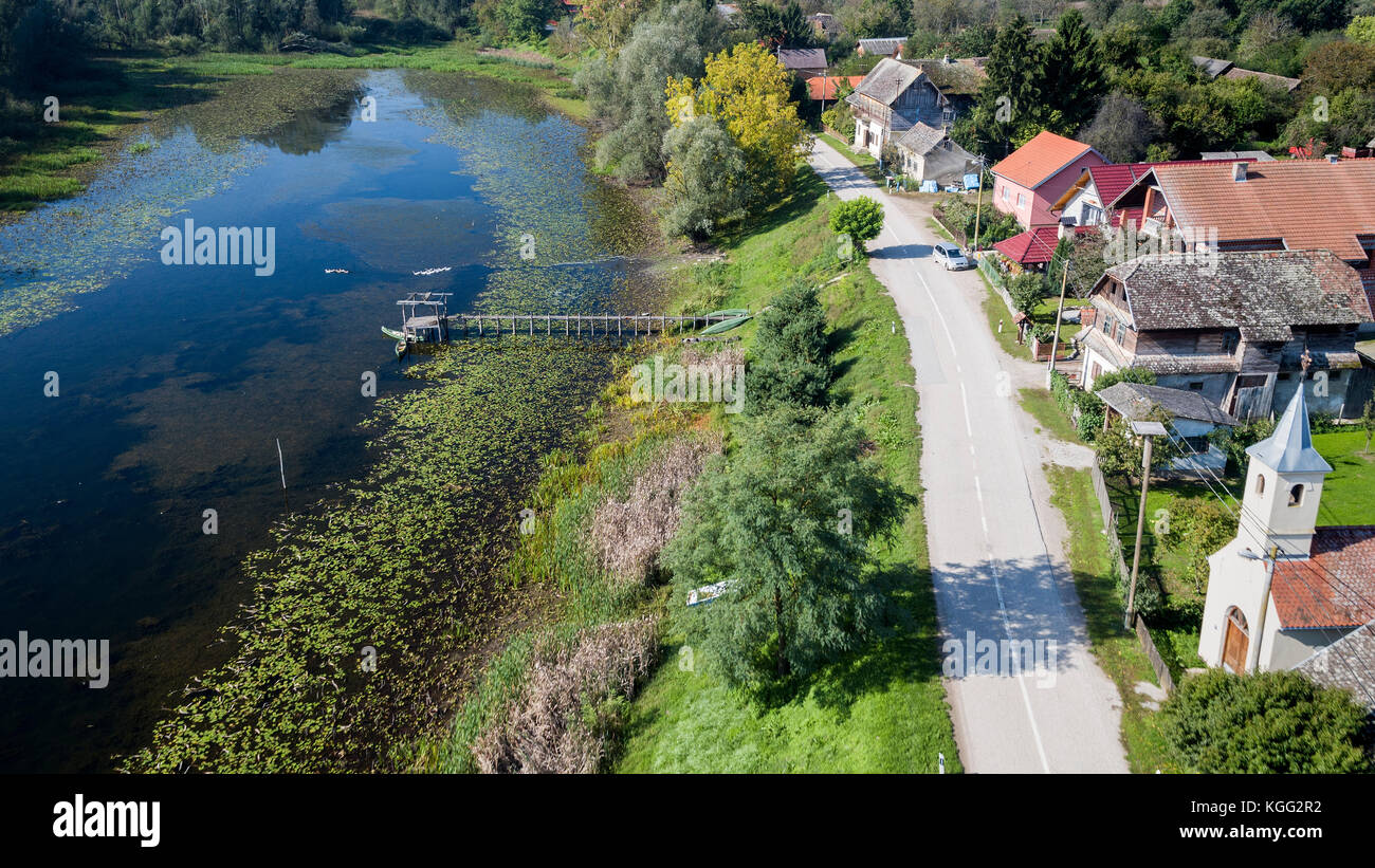 Aerial view of the traditional wooden village near the oxbow lake in
