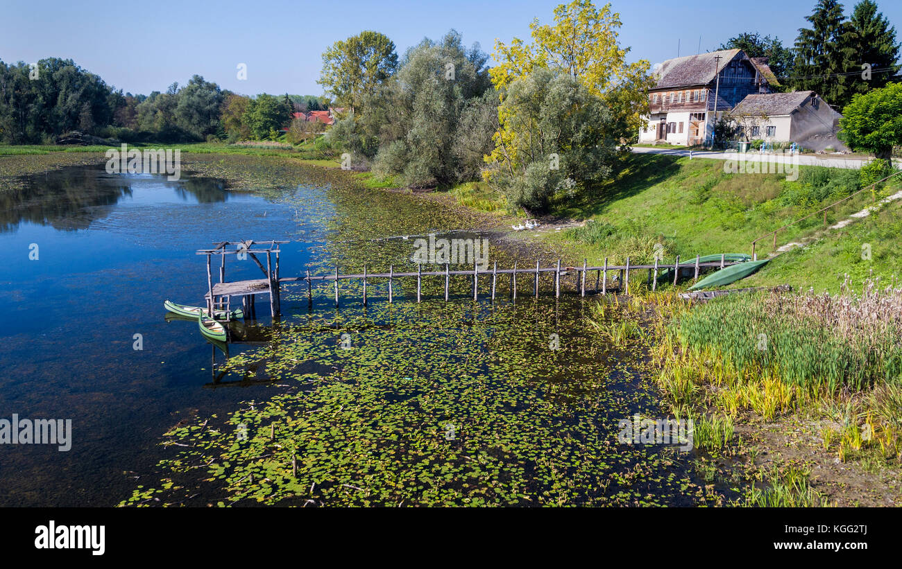 Aerial view of the traditional wooden village near the oxbow lake in