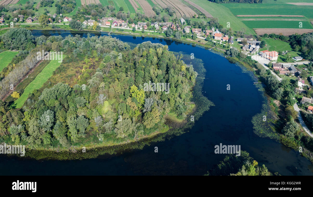 Aerial view of the traditional wooden village near the oxbow lake in