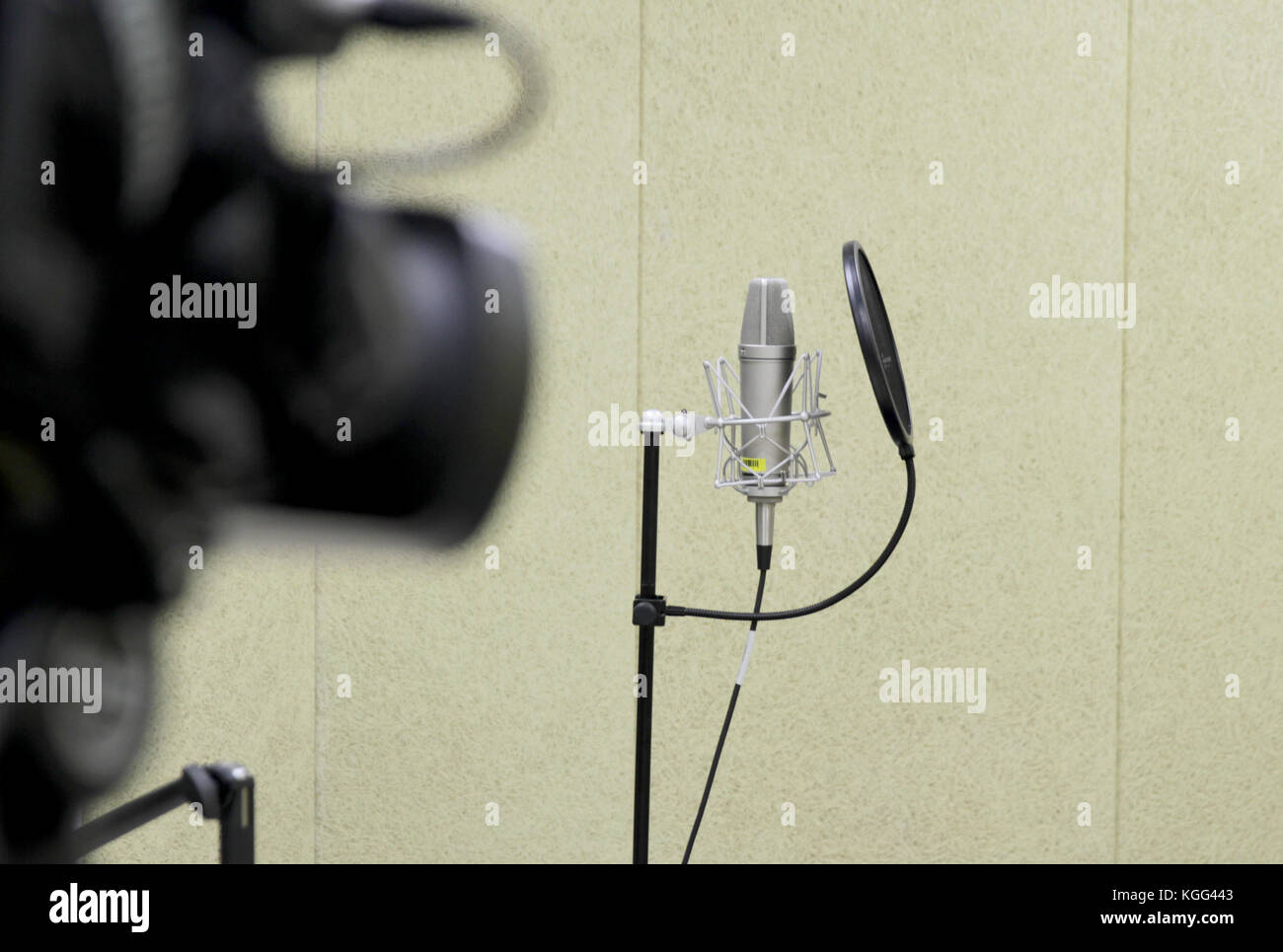 Professional studio microphone over music studio Stock Photo by
