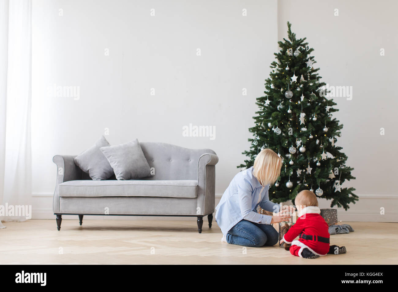 Mother with child opening presents Stock Photo