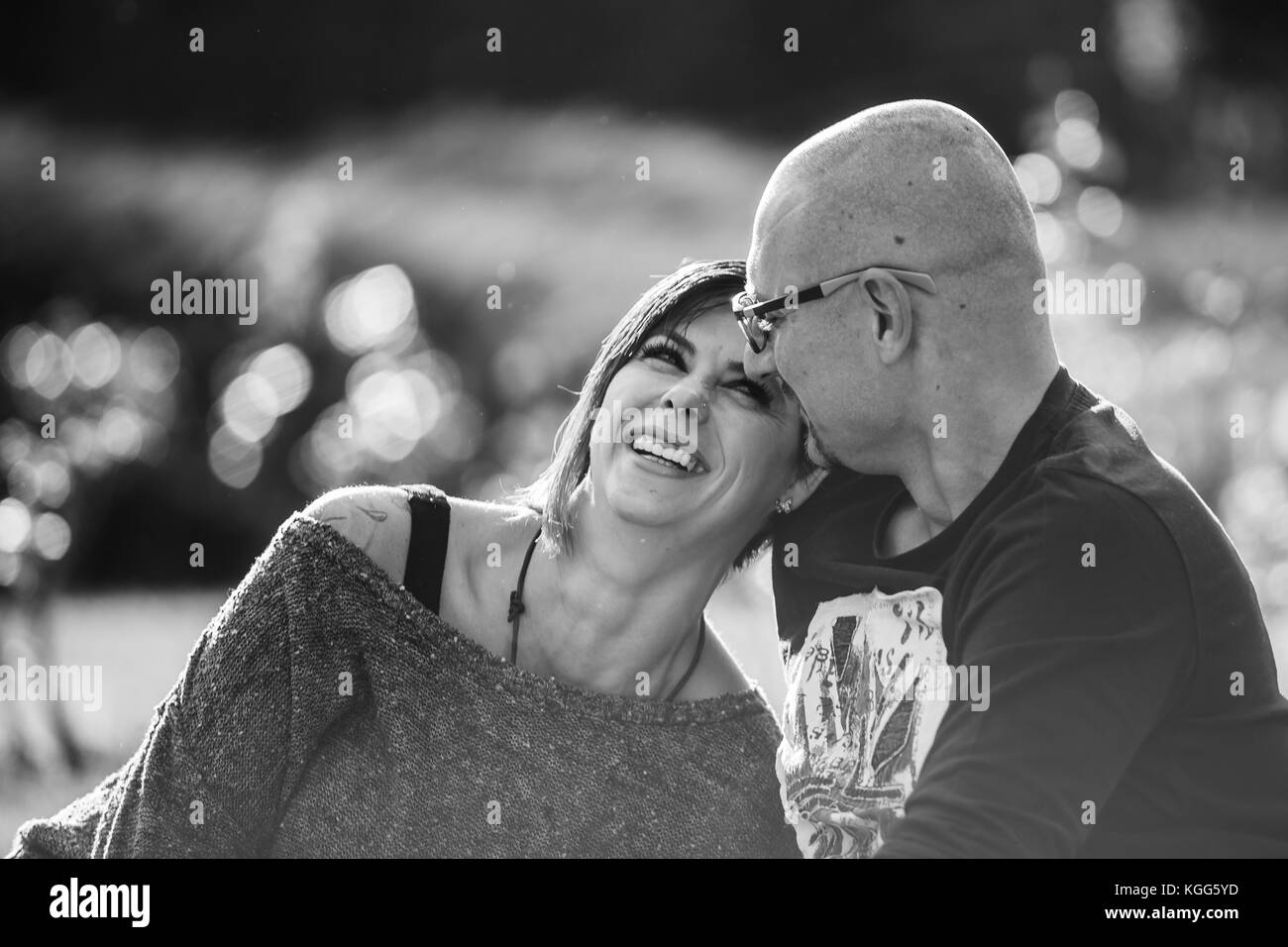 Portrait of happy couple in the park Stock Photo - Alamy