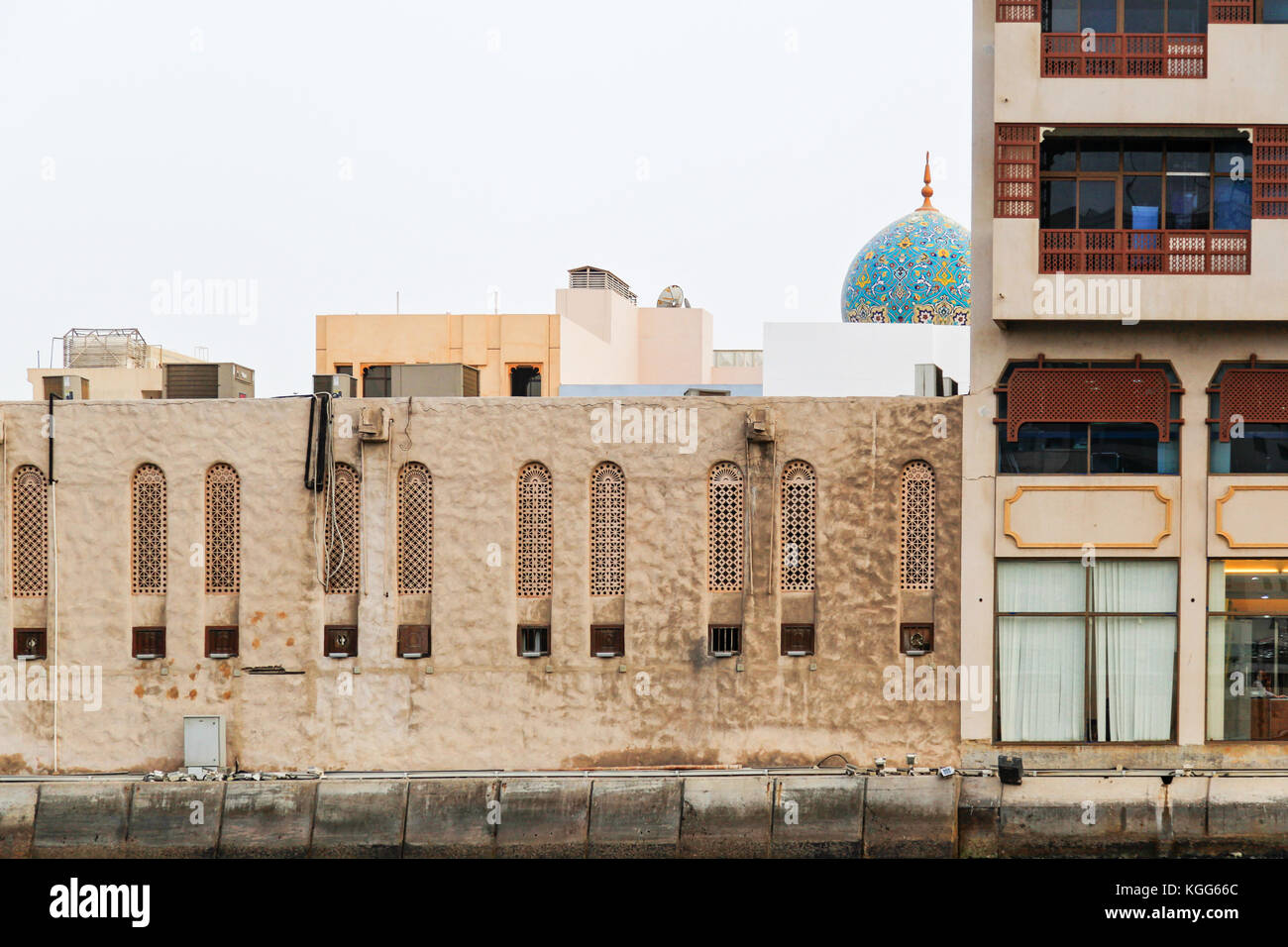 Detail of architecture in Bur Dubai with roof of Al Juma Mosque at the background Stock Photo