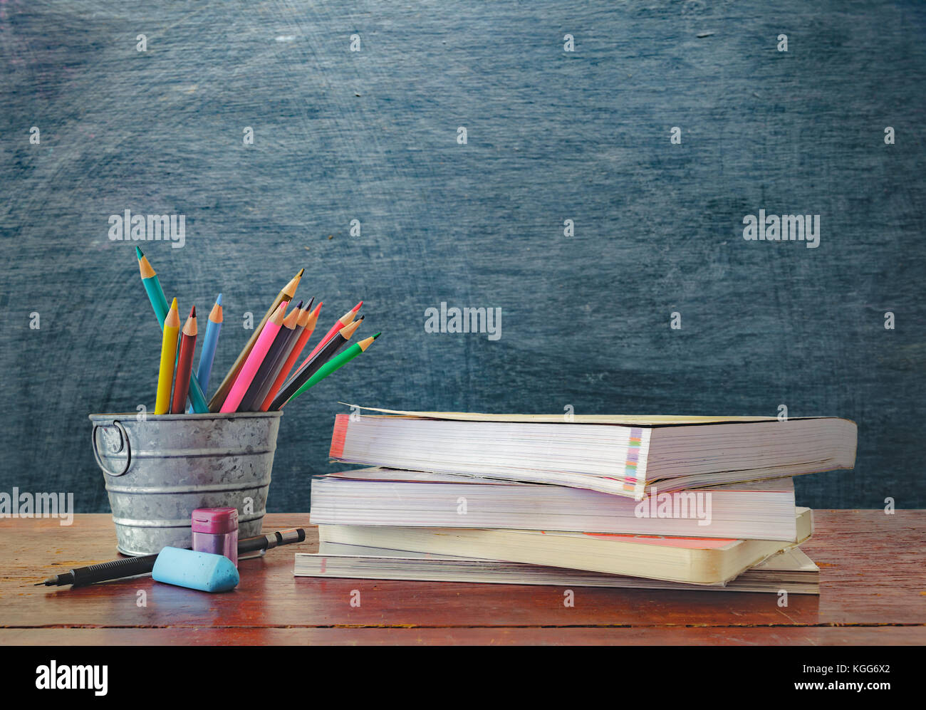 Educational Equipment. On the student desk and the blackboard background.  education concept Stock Photo - Alamy