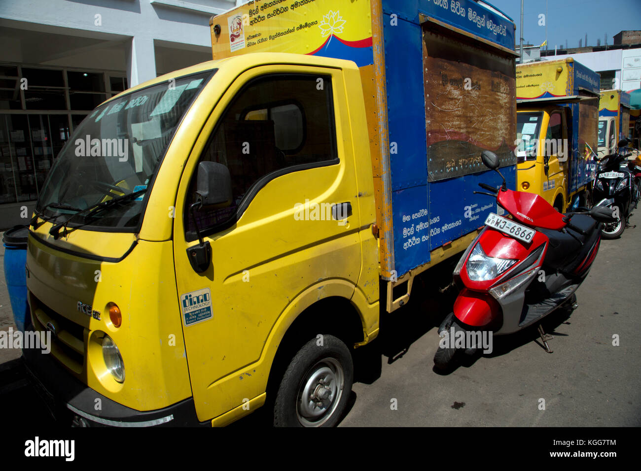 Colombo Sri Lanka A row of vans and motorcycles Stock Photo - Alamy