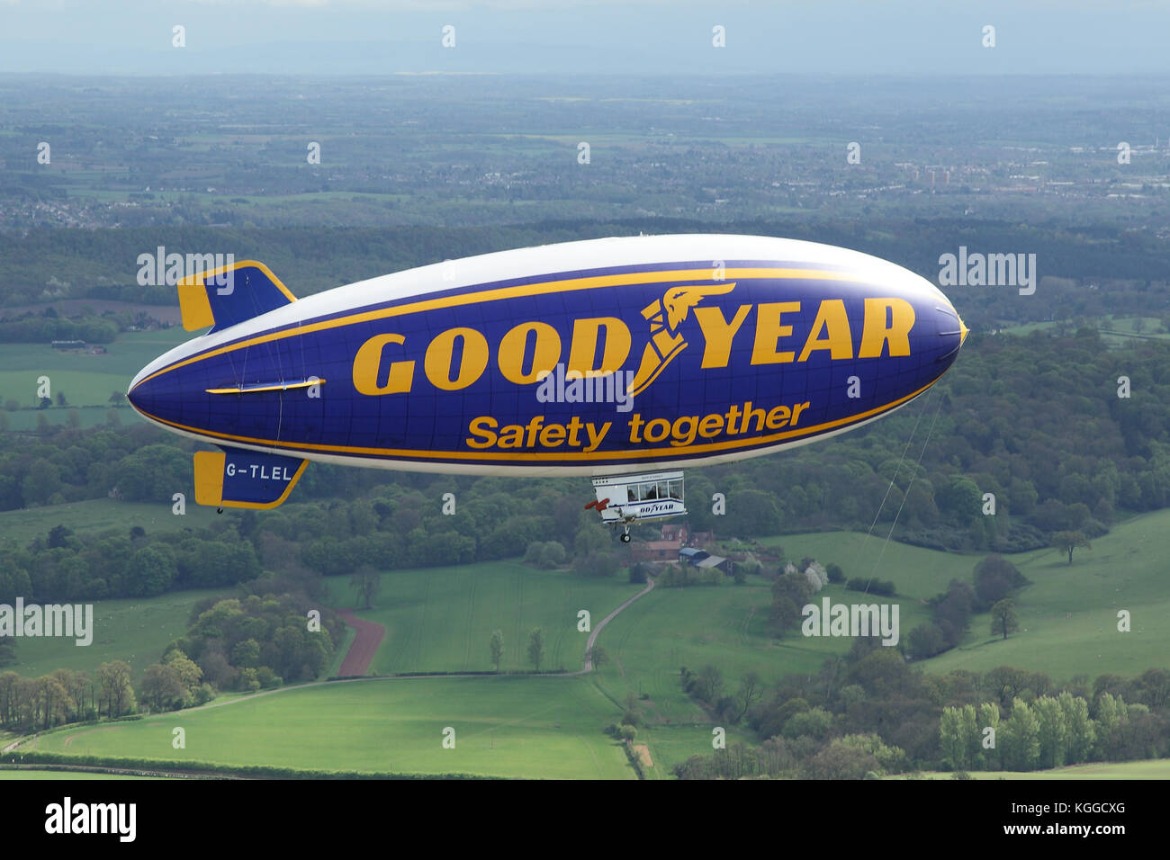 Air to air in flight Goodyear dirigible blimp / airship G-TLEL Spirit of Safety airborne flying over Shropshire countryside from Halfpenny Green. Stock Photo
