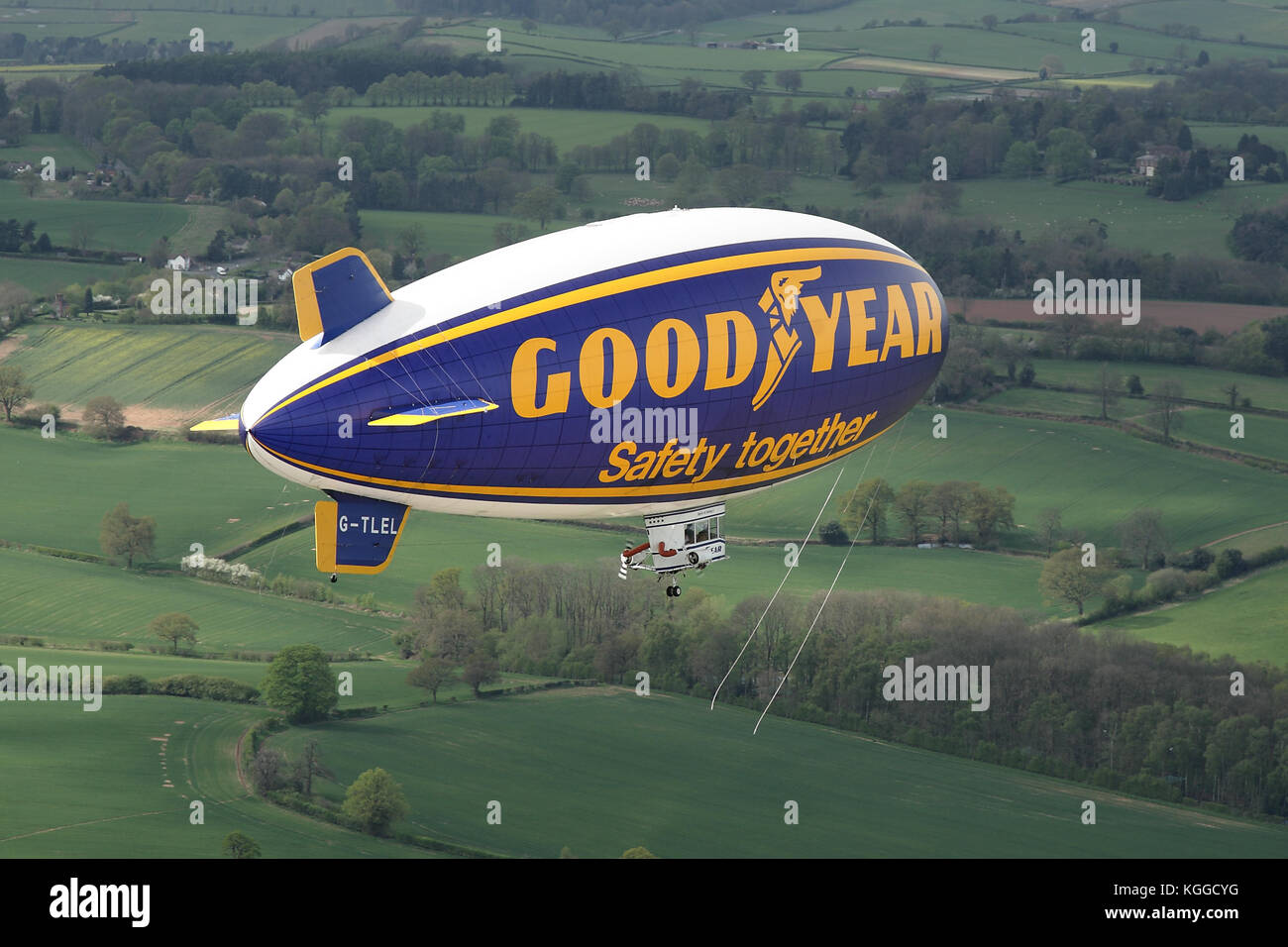 Air to air in flight Goodyear dirigible blimp / airship G-TLEL Spirit of Safety airborne flying over Shropshire countryside from Halfpenny Green. Stock Photo