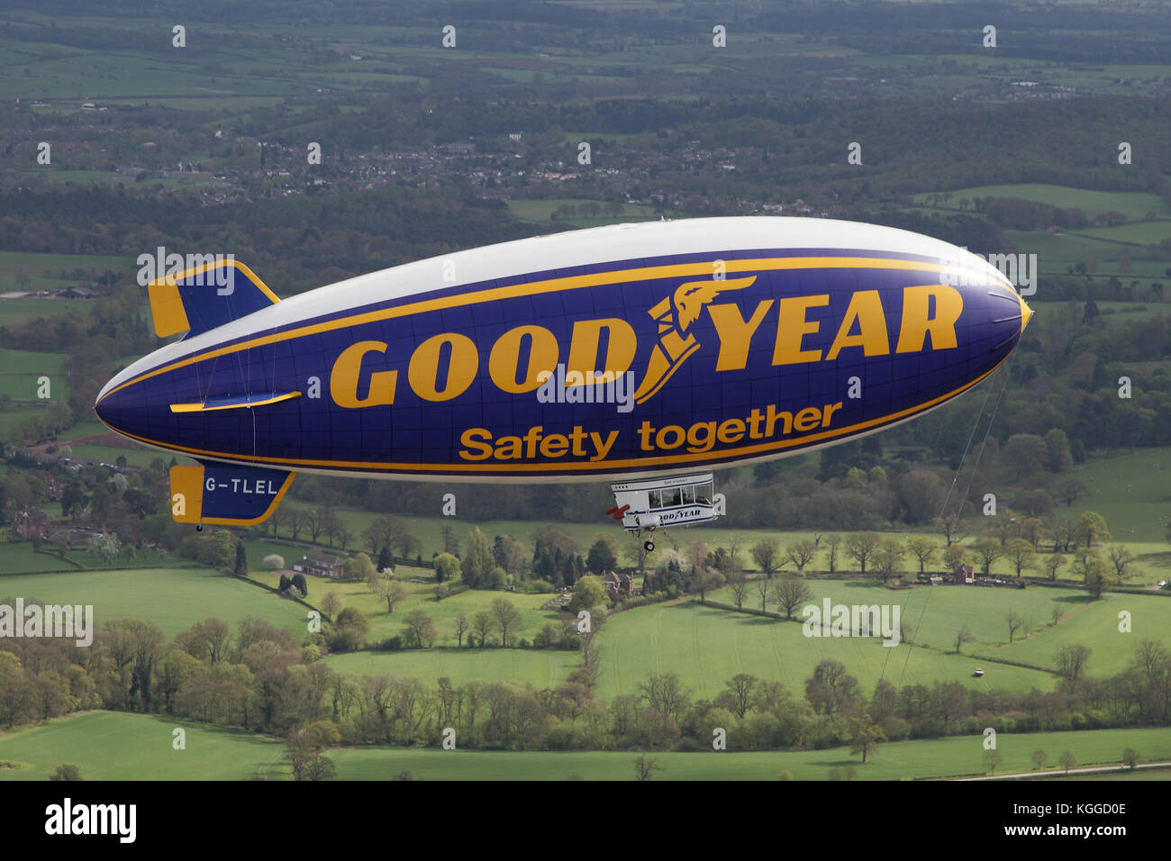 Air to air in flight Goodyear dirigible blimp / airship G-TLEL Spirit of Safety airborne flying over Shropshire countryside from Halfpenny Green. Stock Photo