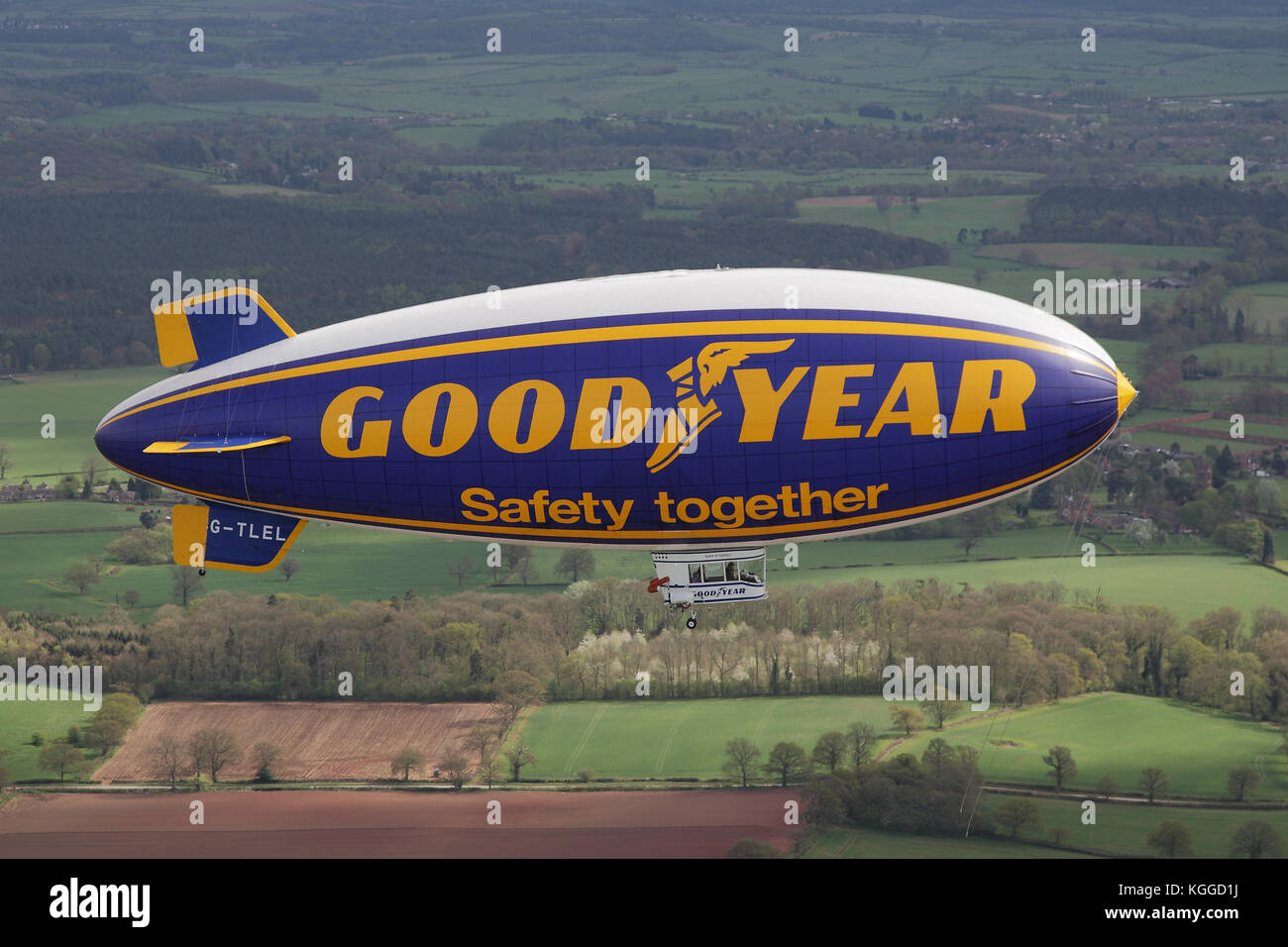 Air to air in flight Goodyear dirigible blimp / airship G-TLEL Spirit of Safety airborne flying over Shropshire countryside from Halfpenny Green. Stock Photo