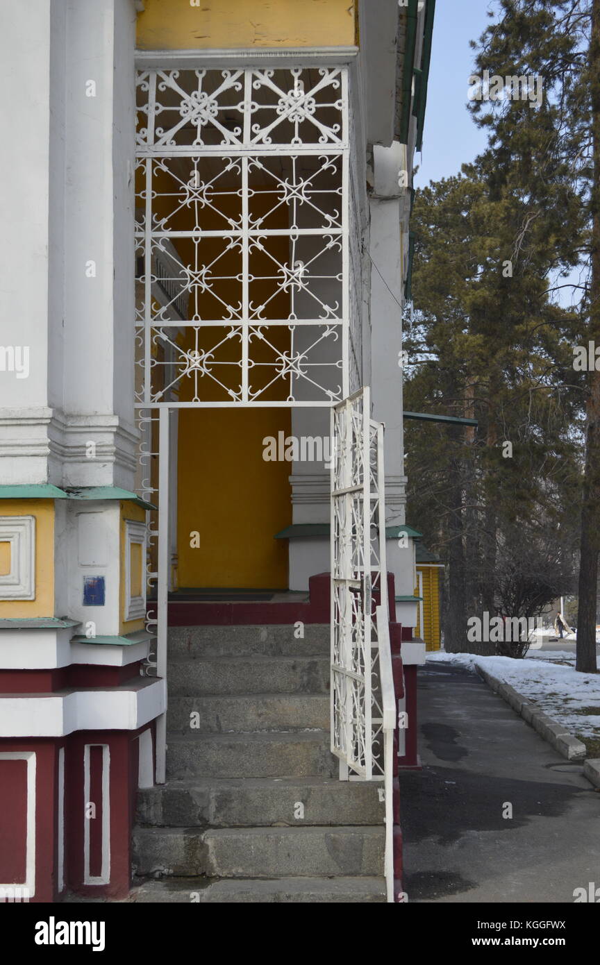 A metal decorative gate of Russian orthodox Zenkov cathedral, 1907, in Panfilov park, Almaty, Kazakhstan. Second tallest wooden building in the world. Stock Photo