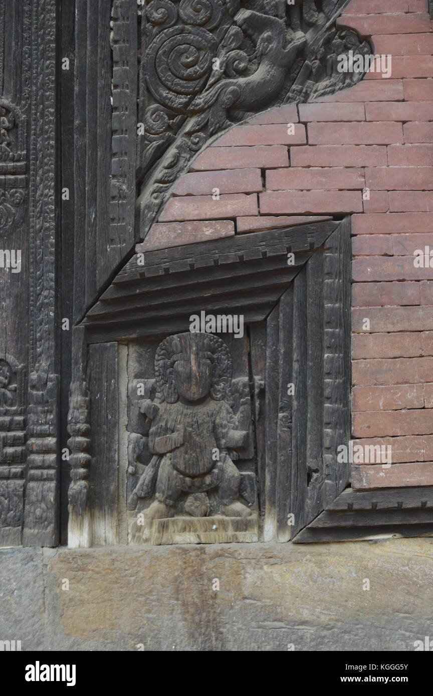 Ancient carving of a Hindu god in wood in Durbar square, Bhaktapur, Nepal. Stock Photo