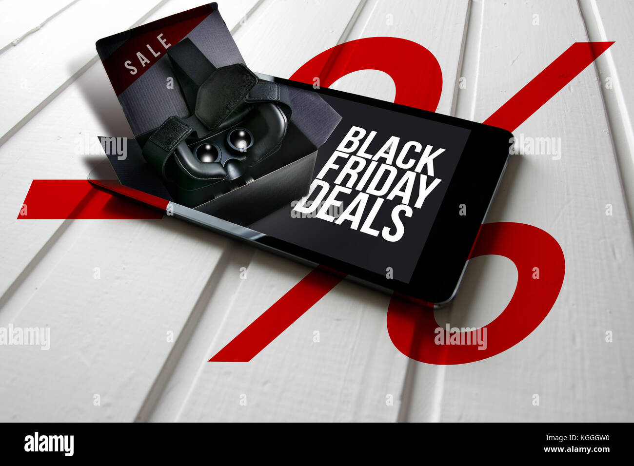 Black friday deals, promotion on computer tablet screen, box with virtual reality glasses come out of the tablet screen. Conceptual image Stock Photo