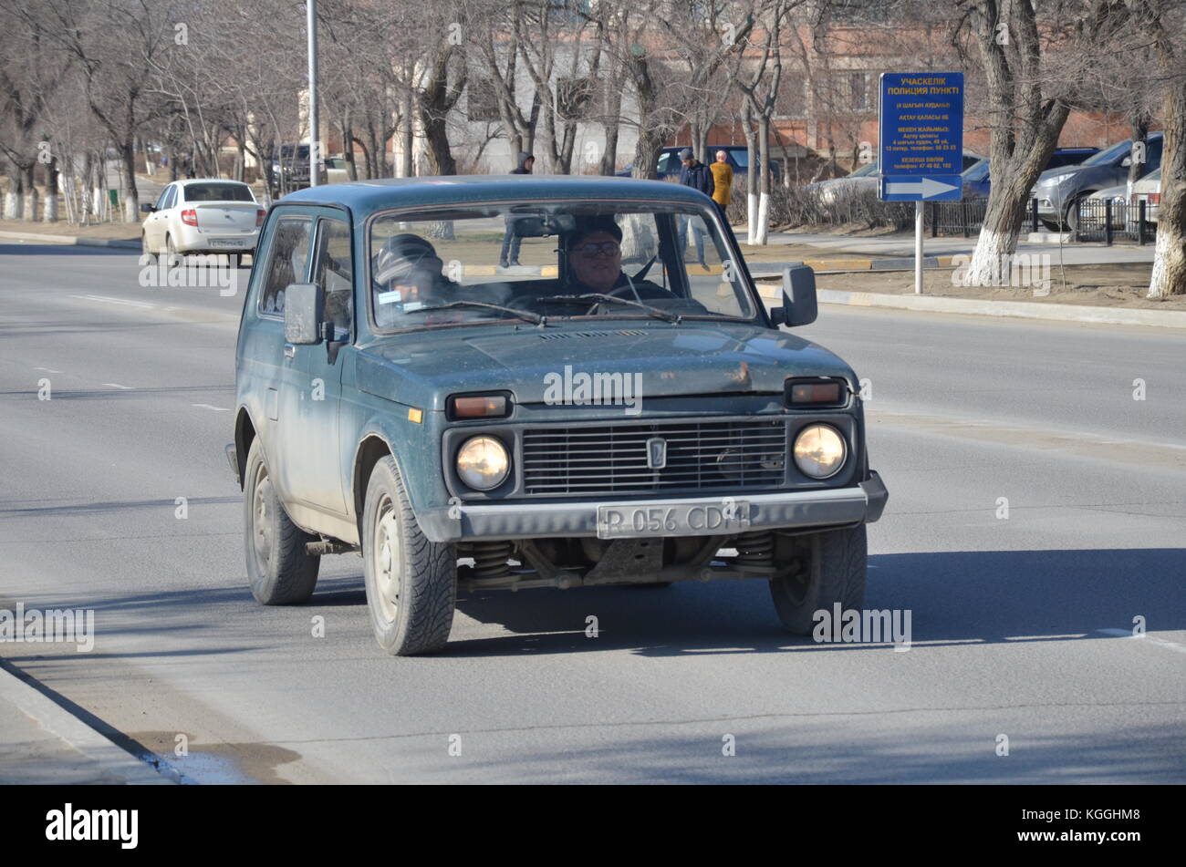 Russian ex-soviet car lada niva, unbreakable. easy to fix. Pic taken in Kazakhstan. Kazakh people. couple driving. Stock Photo
