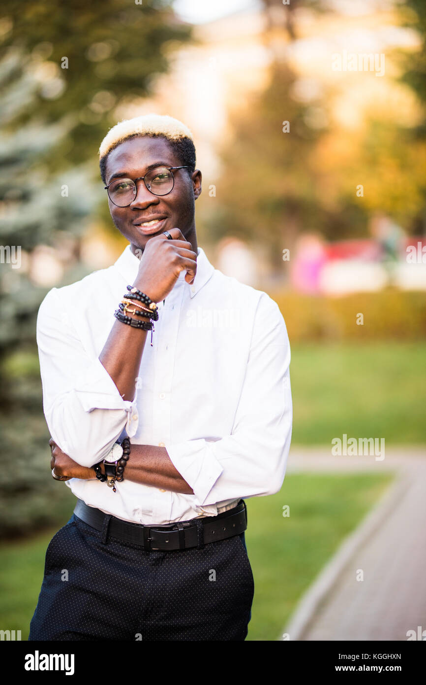 Young Handsome Afro American Man With Blonde Hair Walking In The