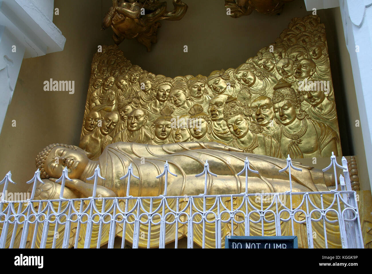 Serene mood of Buddha in eternal sleep and mourning disciples Stock Photo