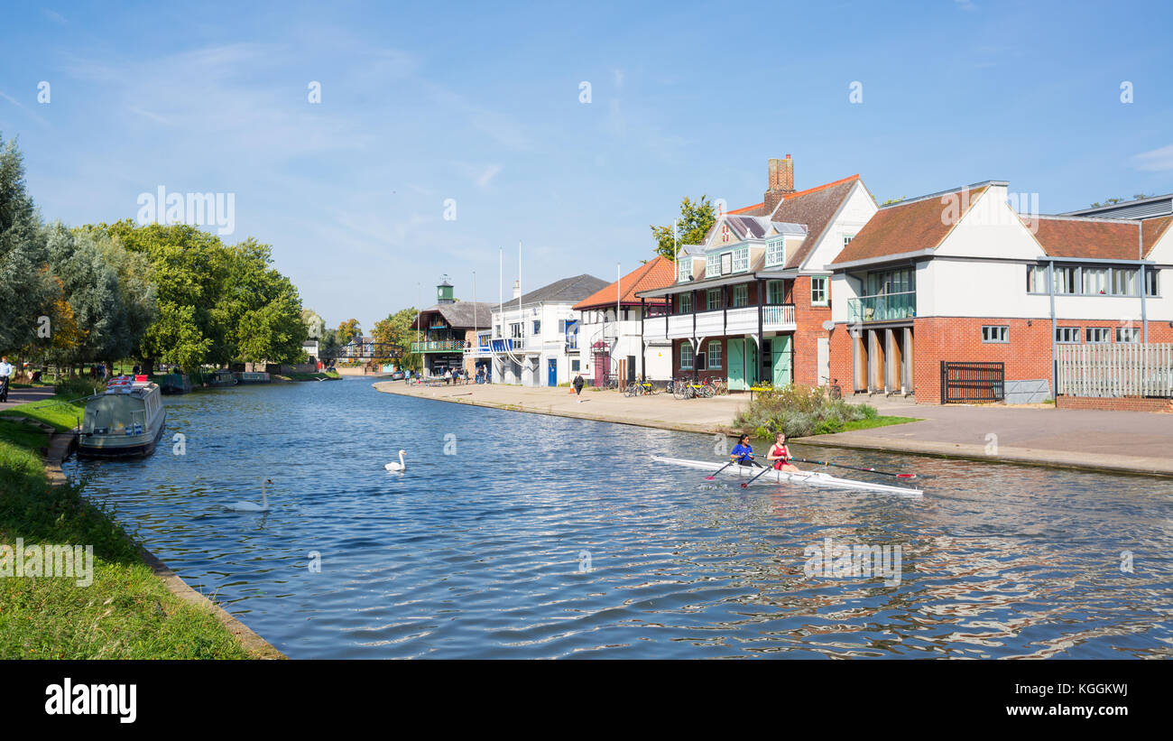 Two women students rowing on the River Cam in front of Goldie Boathouse CUBC rowing club near Midsummer Common, Cambridge England, Uk Stock Photo