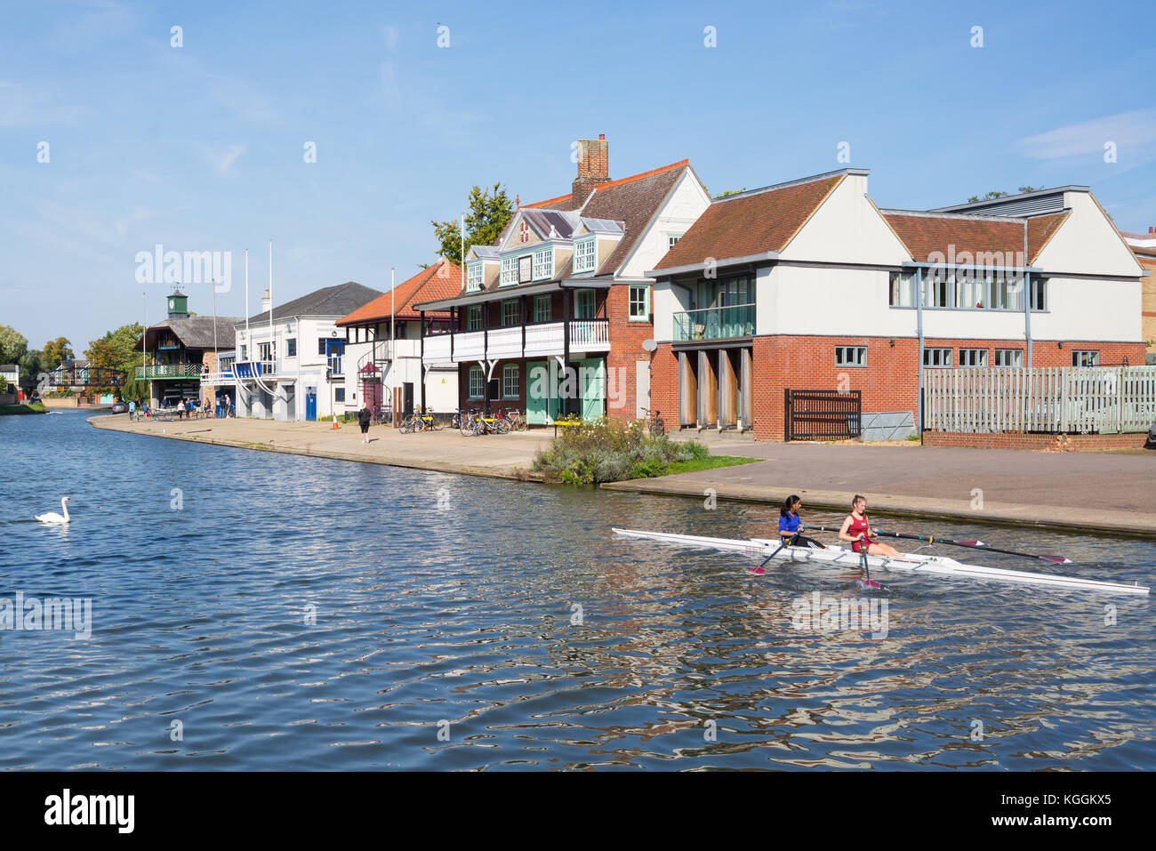 Two women students rowing on the River Cam in front of Goldie Boathouse ...