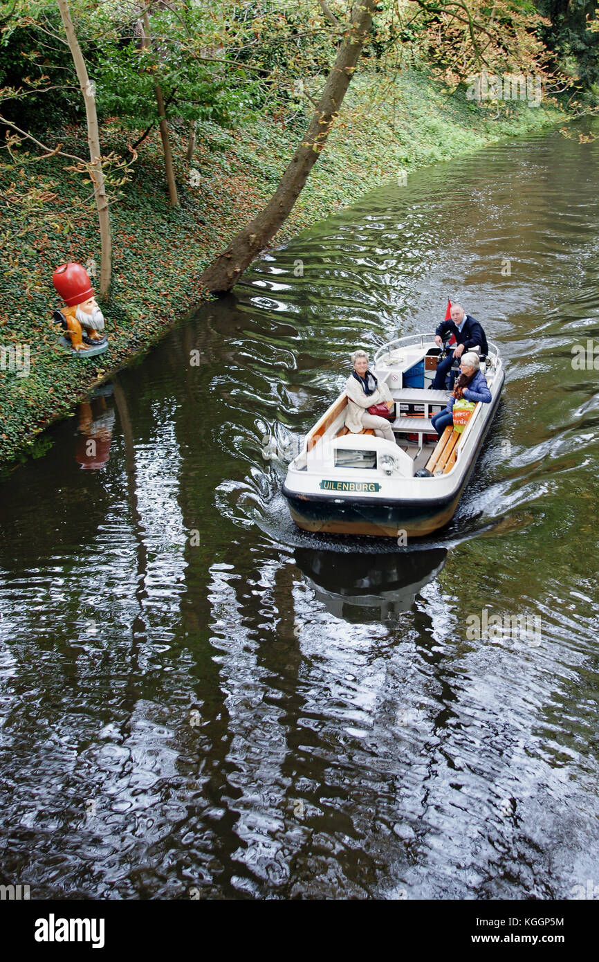 Electric trip boat passes one of the many Hieronymous Bosch fantastical