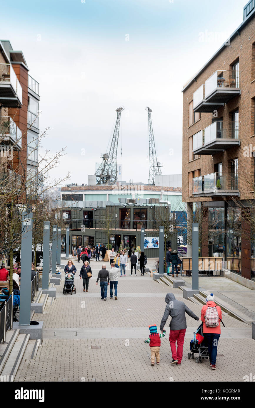 Shoppers on Gaol Ferry Steps at Wapping Wharf in Bristol Harbour UK