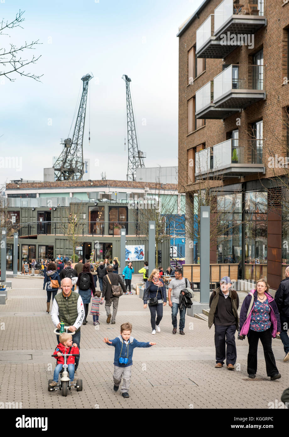 Shoppers on Gaol Ferry Steps at Wapping Wharf in Bristol Harbour UK