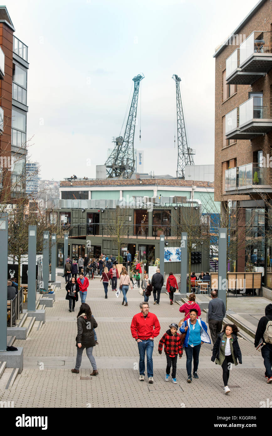 Shoppers on Gaol Ferry Steps at Wapping Wharf in Bristol Harbour UK