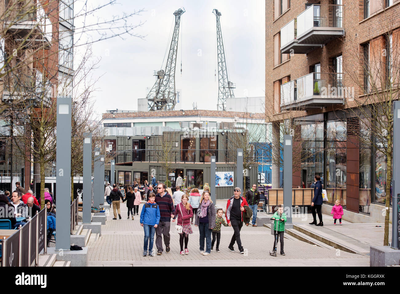 Shoppers on Gaol Ferry Steps at Wapping Wharf in Bristol Harbour UK
