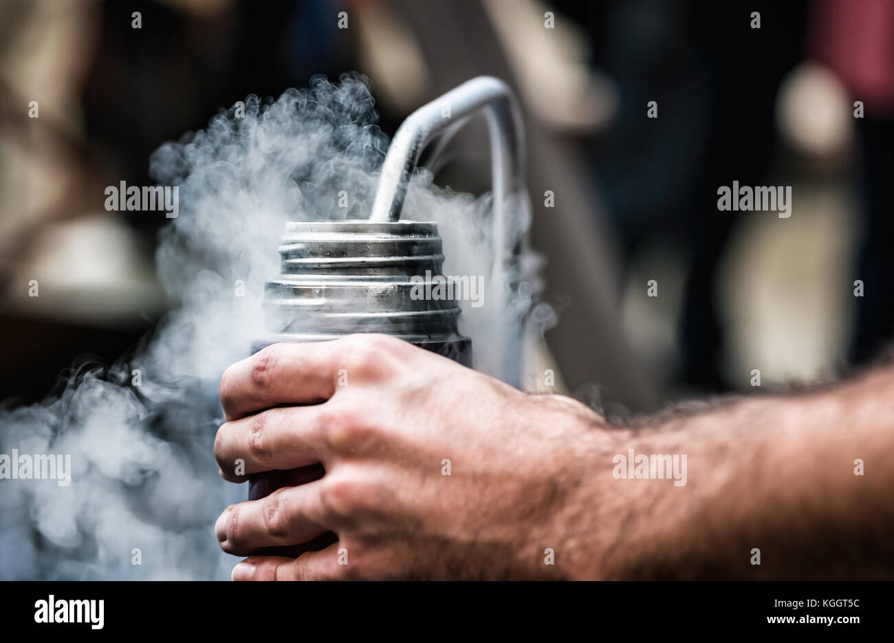 Filling the thermos with liquid nitrogen Stock Photo